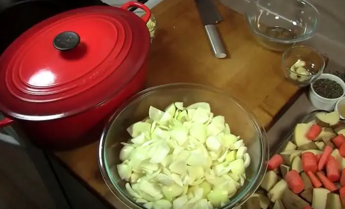 Ultimate Slow Cooker Beef Roast Recipe onions in the pan