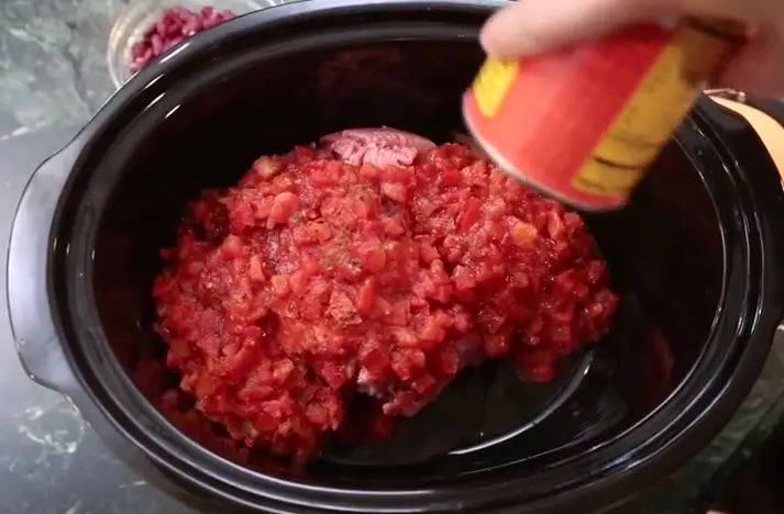 Slow Cooker Turkey Chili add turkey and tomatoes