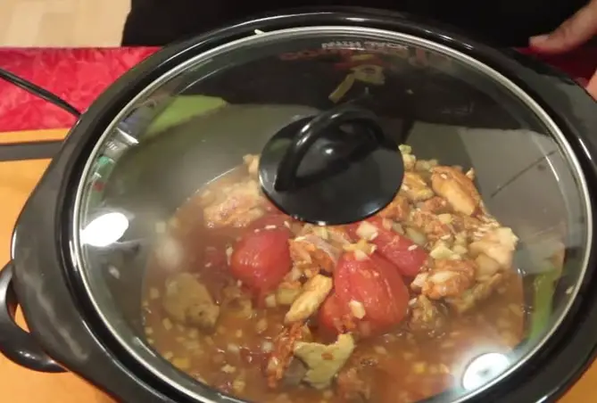 Busy People's Slow Cooker Chicken Paella cover and cook it