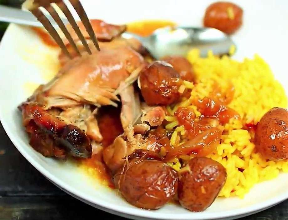 Slow Cooker Honey Garlic Chicken Thighs and Potatoes serve over yellow rice