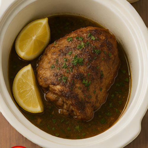 You haven’t lived until you’ve tried slow cooker lamb shoulder bathed in lemon + rosemary